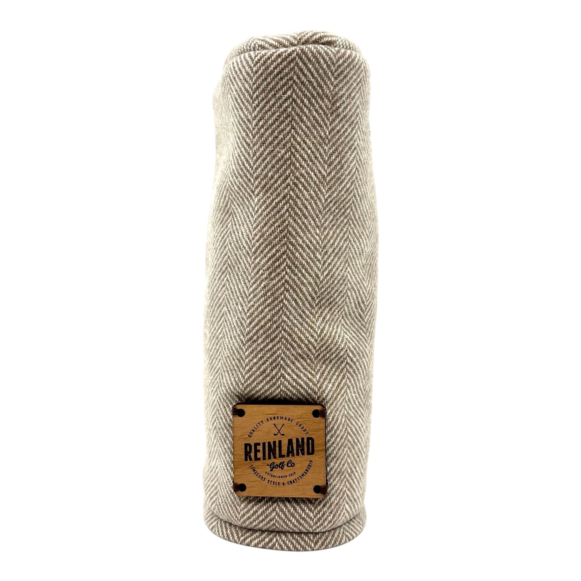 Herringbone patterned hybrid head cover with 'Reinland' label on a white background