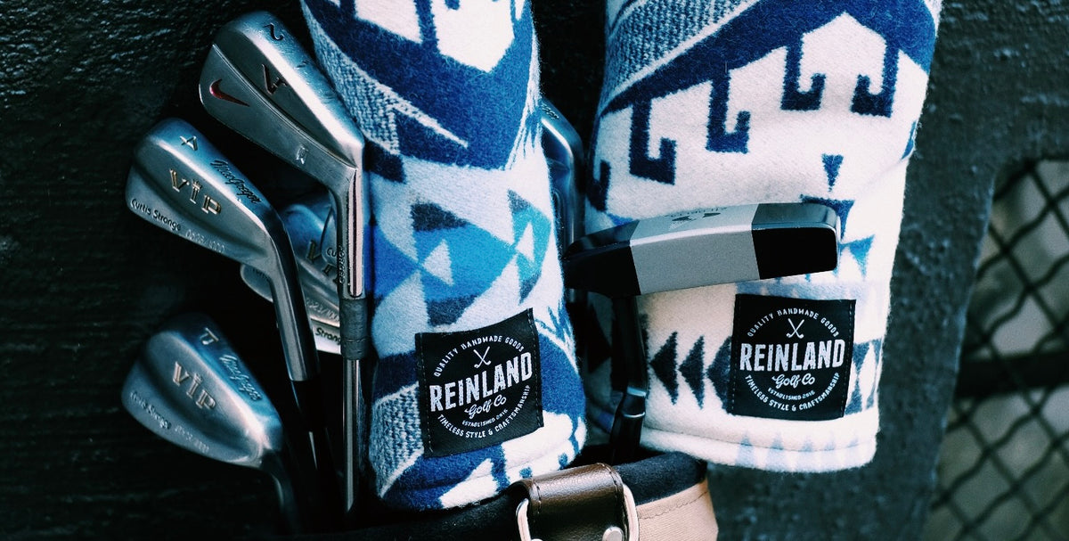 blue and white golf headcovers