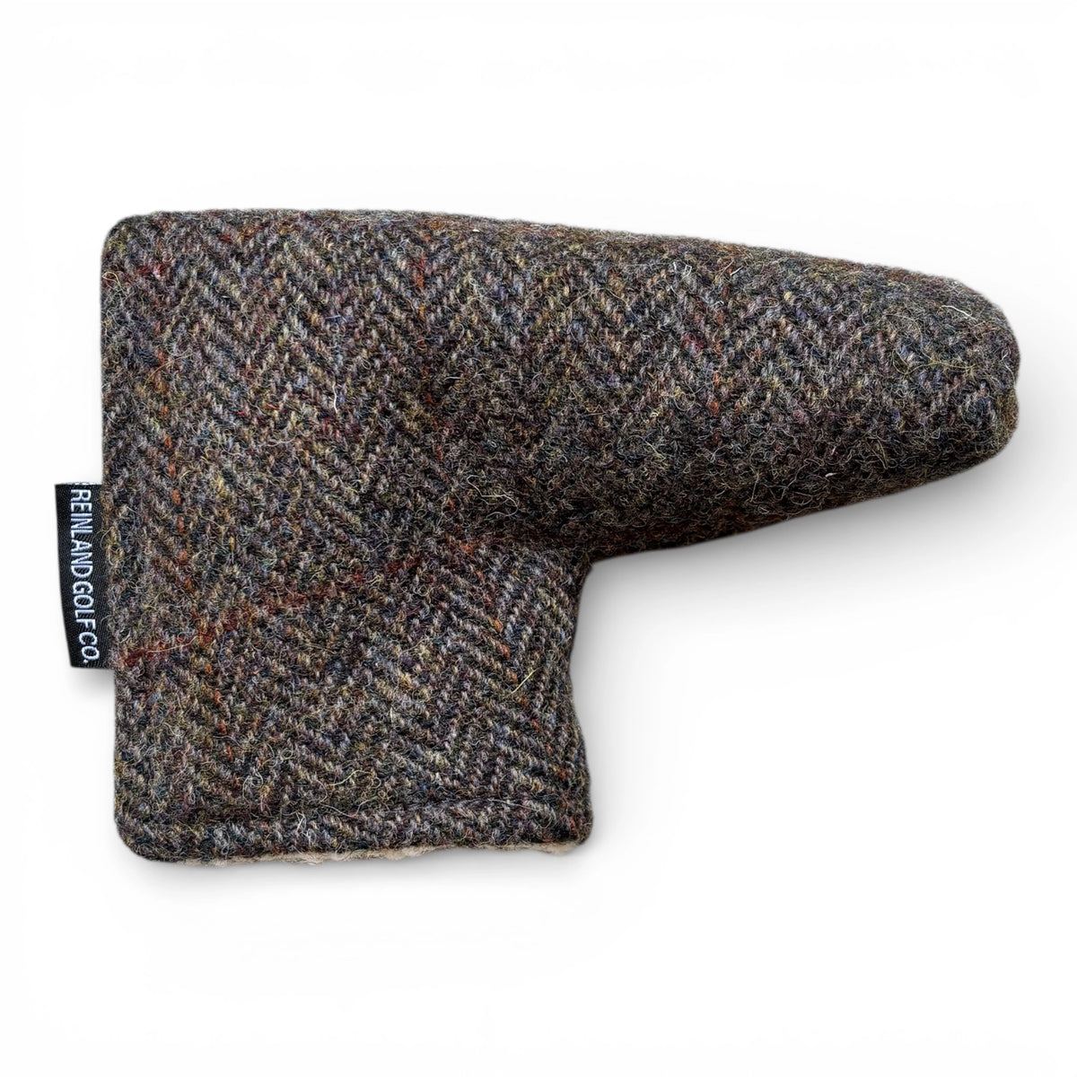 Textured golf club head cover with brand label on a white background