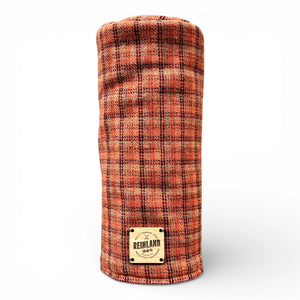 Plaid patterned product with 'Reinland' label on a white background