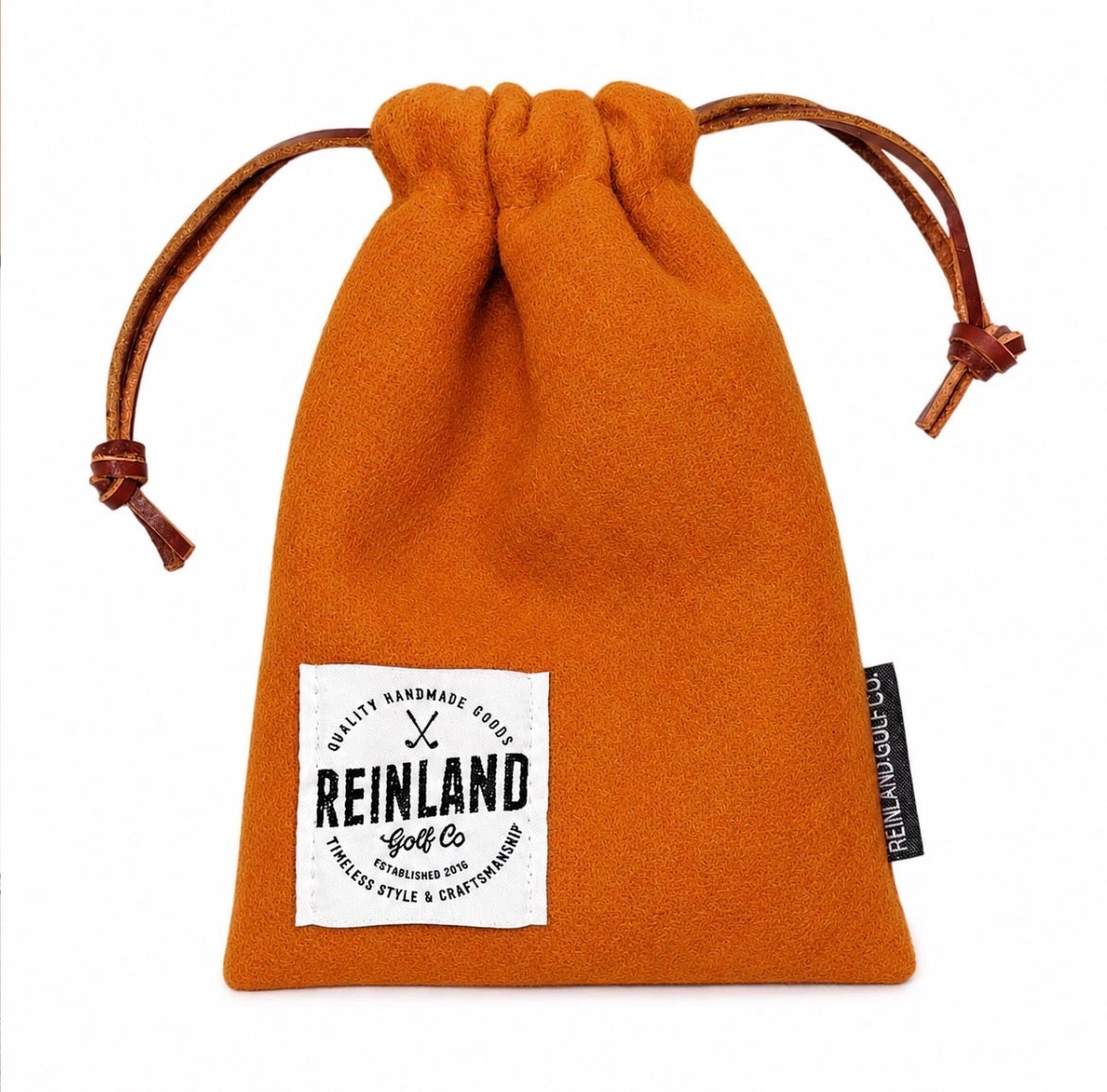 Orange drawstring pouch with 'REINLAND Golf Co' label on a white background